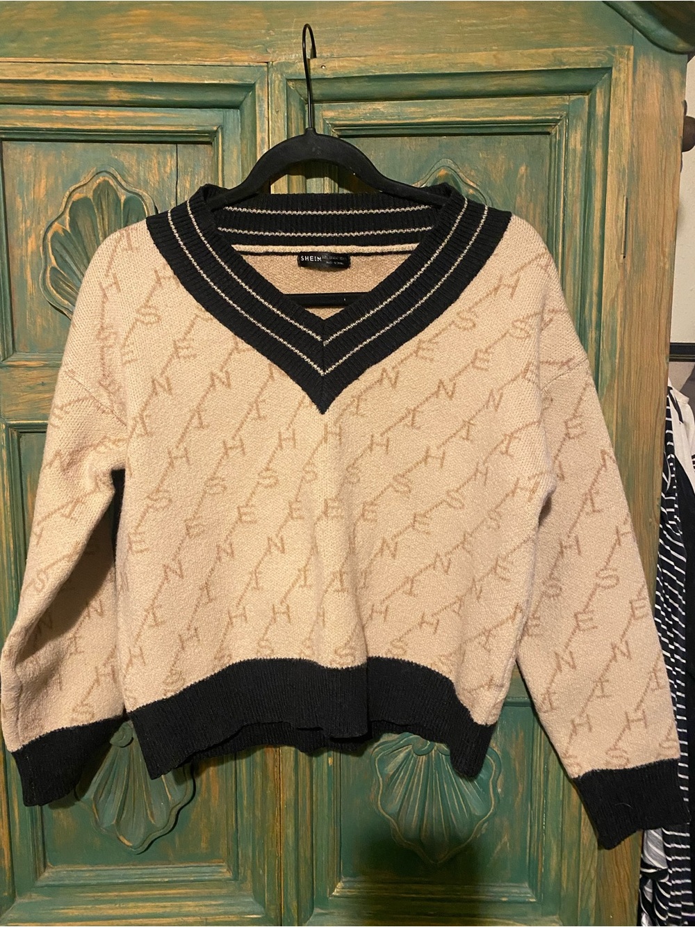 SHEIN Cream Knit V-Neck Sweater with Black Trim and Logo Pattern